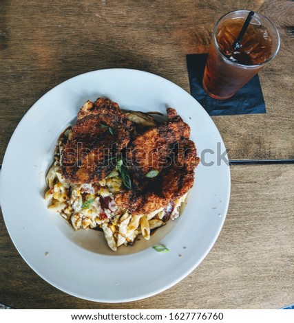 Pan Seared chicken with Pasta and a southern sweet tea at a classy, traditional restaurant. Perfect for meals, dining, and per diem, stock photos; business dinner, upscale picnic, satisfying food