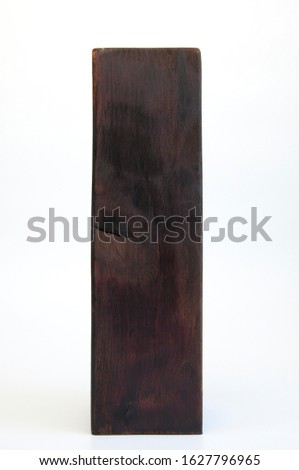 Large wooden brown block. Design column made of wood. On white background