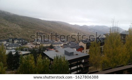 Pradollano village in Sierra Nevada, Granada, air photo showing mountains, buildings and a foggy and cloudy weather