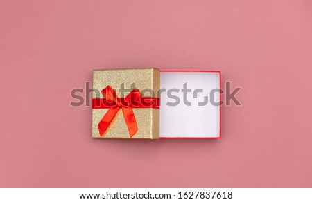 Little gift box on pink background. Above view 