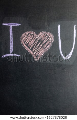The inscription on the chalk board I love you. Valentine's Day