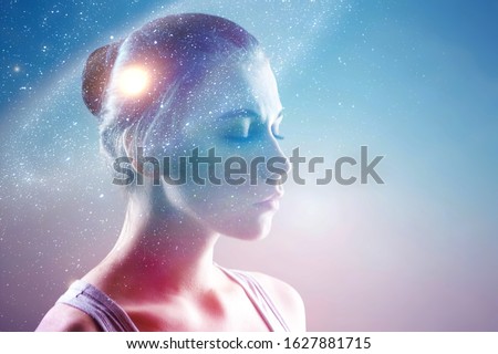 Double exposure portrait of a dreamer young woman face with galaxy universe space Royalty-Free Stock Photo #1627881715