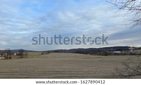 Three skyline photos of a farm area