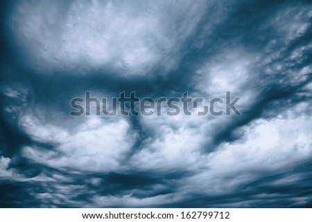 abstract background of dramatic dark clouds, tinted