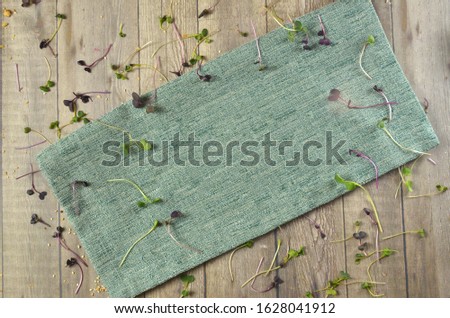 Napkin on wooden kitchen table. top view mock up for design.