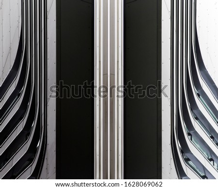 Collage photo of gray steel panels with slots resembling industrial building exterior fragment. Abstract modern architecture background with geometric composition of parallel lines and curves.