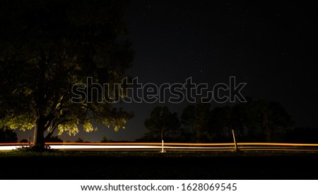 Car lights long exposure stars landscape