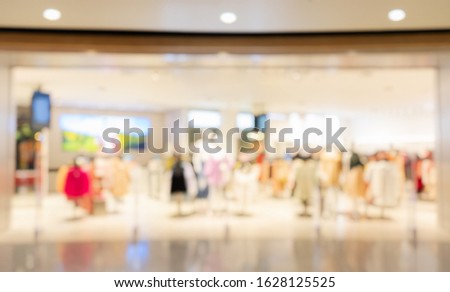 Abstract Blurred background, blur display clothing store in shopping mall with bokeh light, defocused shopping mall in department store for Fashion business backdrop.