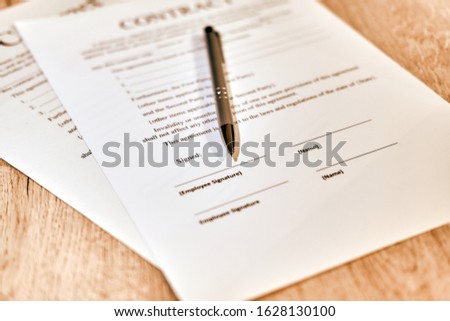 Contract sheet with a pen on a wight background
