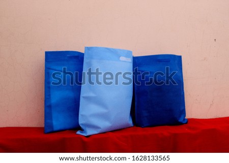 Two Blue Color Bag and One royal blue Color Fabric Bags. Non Woven ECO Shopping Bags. Plastic Free Bags. Copy Space for Text and Logo