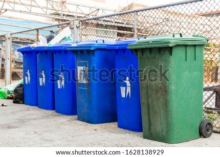 Plastic containers for garbage of different types. Waste management concept. 