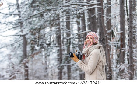 Christmas fun. woman use vintage camera. hobby time outdoor in winter day. admiring winter mountain landscape. Happy tourist woman in winter. professional photographer outdoor in winter.