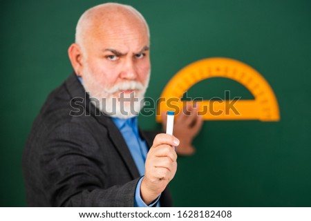 now you try. back to school. selective focus. Education and school concept. home learning. senior man teacher use protractor tool. bearded tutor man draw with ruler on blackboard.