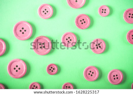 wooden buttons lie on a bright background