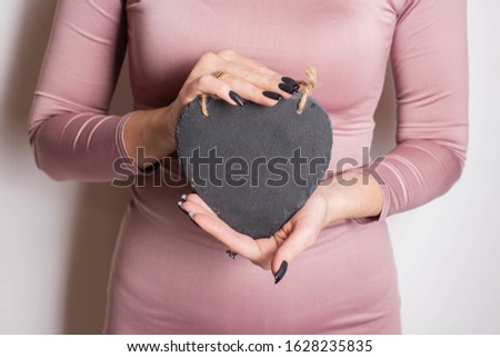 girl keeps in hands heart. girl with heart