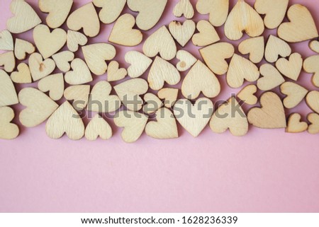 Valentines day background with wooden hearts