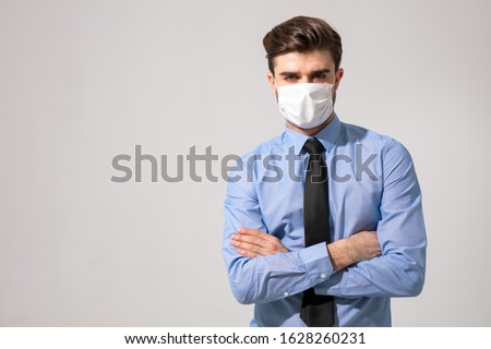 is time to protect all the time. elegant man wearing a mouth protection to prevent getting sick at work or on the way to work Royalty-Free Stock Photo #1628260231