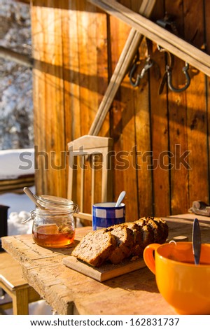 Snow winter cottage breakfast on wooden table