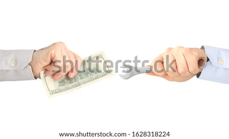 hands with work tool and money on a white background. salary. business relationship.
