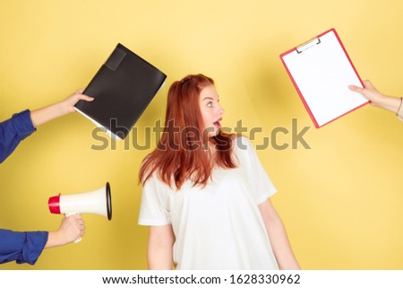 No reports. Caucasian young woman's portrait on yellow studio background, too much tasks. How to manage time right. Concept of office working, business, finance, freelance, self management, planning.