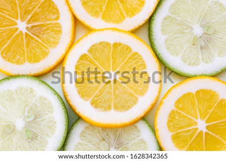 
Studio shot of fresh lemon and lime slices