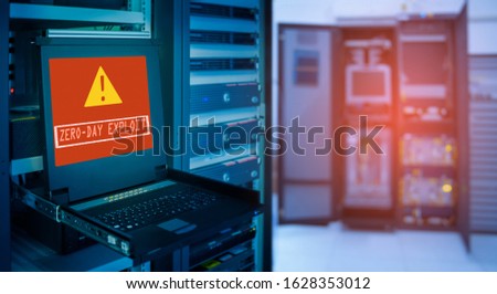 "Zero day exploit"and Alert icon on display of computer for management server in data server room with copy space Royalty-Free Stock Photo #1628353012