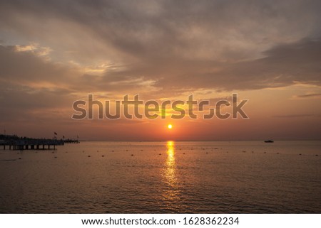 Beautiful summer sunset or sunrise golden time at beach of Turkey. Horizontal color photography.