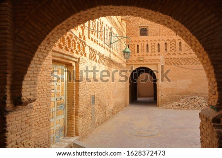 The historical medina of Tozeur (Ouled el Hadef), Tunisia, decorated with patterns of bricks and arcades  Royalty-Free Stock Photo #1628372473