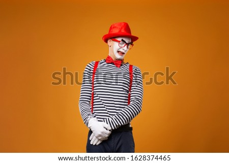 Sad mime man in vest and red hat Isolated