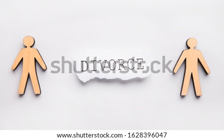 Wooden family, wife and husband on gray table, divorce text, panorama. Family law concept