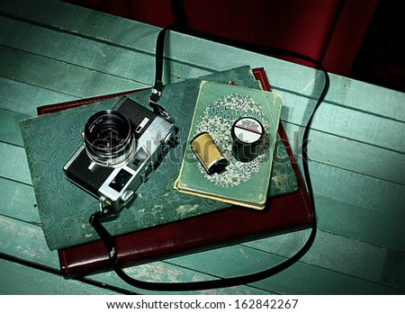 Vintage camera with old photo album
