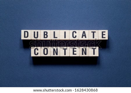 Dublicate content word concept on cubes Royalty-Free Stock Photo #1628430868