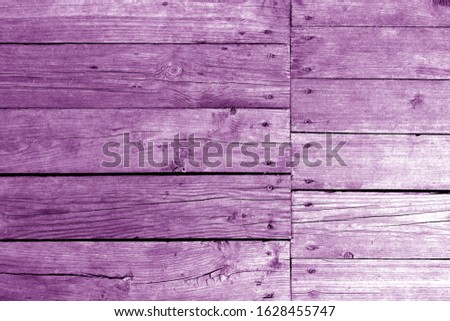 Old wooden wall in purple tone. Abstract background and texture for design.