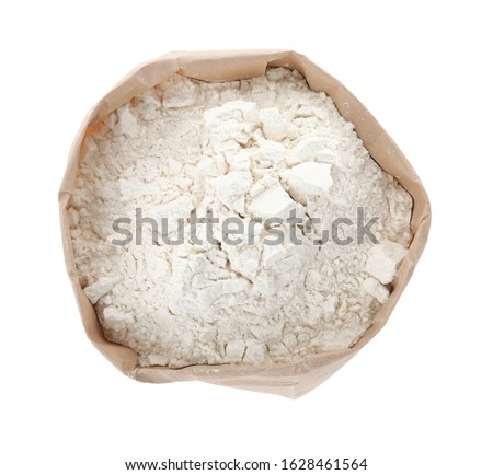 Organic flour in paper bag isolated on white, top view