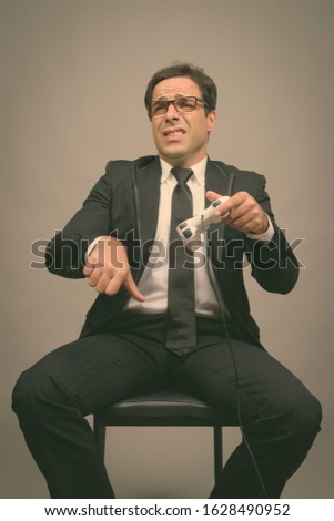 Portrait of handsome Persian businessman in suit