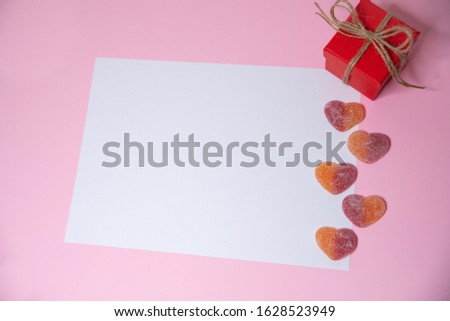Valentine's day greeting card on a pink background with hearts
