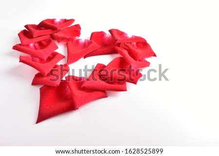 red heart shape of rose petal flower isolated on white background, image romantic love symbol