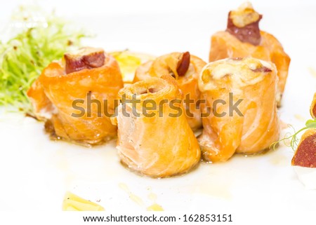 baked salmon rolls on a table in a restaurant