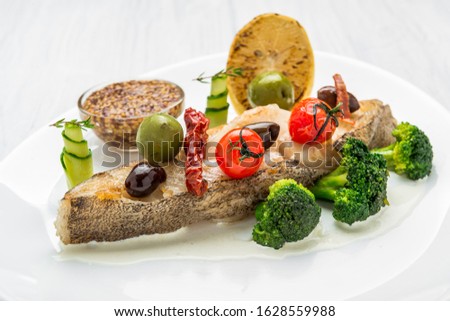 Fried halibut with vegetables and mustard