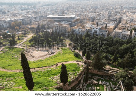 Aerial view from the Acropolis of Athens to the ruins of the theater of Dionysus and the city.