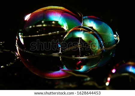 Soap bubble is an extremely thin film of soapy water enclosing air that forms a hollow sphere with an iridescent surface.