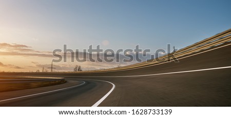 Race Car / motorcycle racetrack after rain on a sunny day. Fast motion blur effect. Ready to race Royalty-Free Stock Photo #1628733139