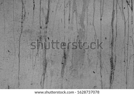 Dirty coating on cement gypsum painted wall. Desolate exterior city facade. Coarse grunge, worn blocks background. Uneven messy surface of stone structure. Retro grey fortified panel texture 3d design