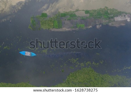 Aerial View Beautiful Bangladeshi Rivers and Wetlands with Small Boats Around Capital City Dhaka