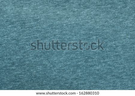 Gray-blue texture of fabric from a textile material for an abstract background, for an empty surface and for wall-paper