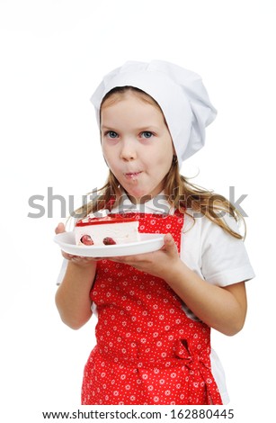 An image of nice child eating cake
