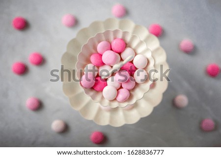 Sweet pink round candies, drops
