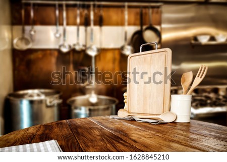 Wooden table background of brown color and free space for your decoration.Kitchen interior and cook time.Restaurant background. Copy space 