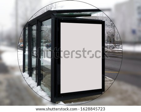 bus shelter at busstop. illustration style raster image. white poster ad display and billboard lightbox. advertising concept. glass and aluminum structure. urban setting. soft snowy blurred background