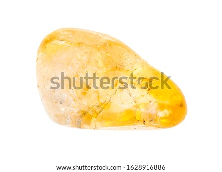 closeup of sample of natural mineral from geological collection - polished citrine (yellow quartz) gem stone isolated on white background Royalty-Free Stock Photo #1628916886